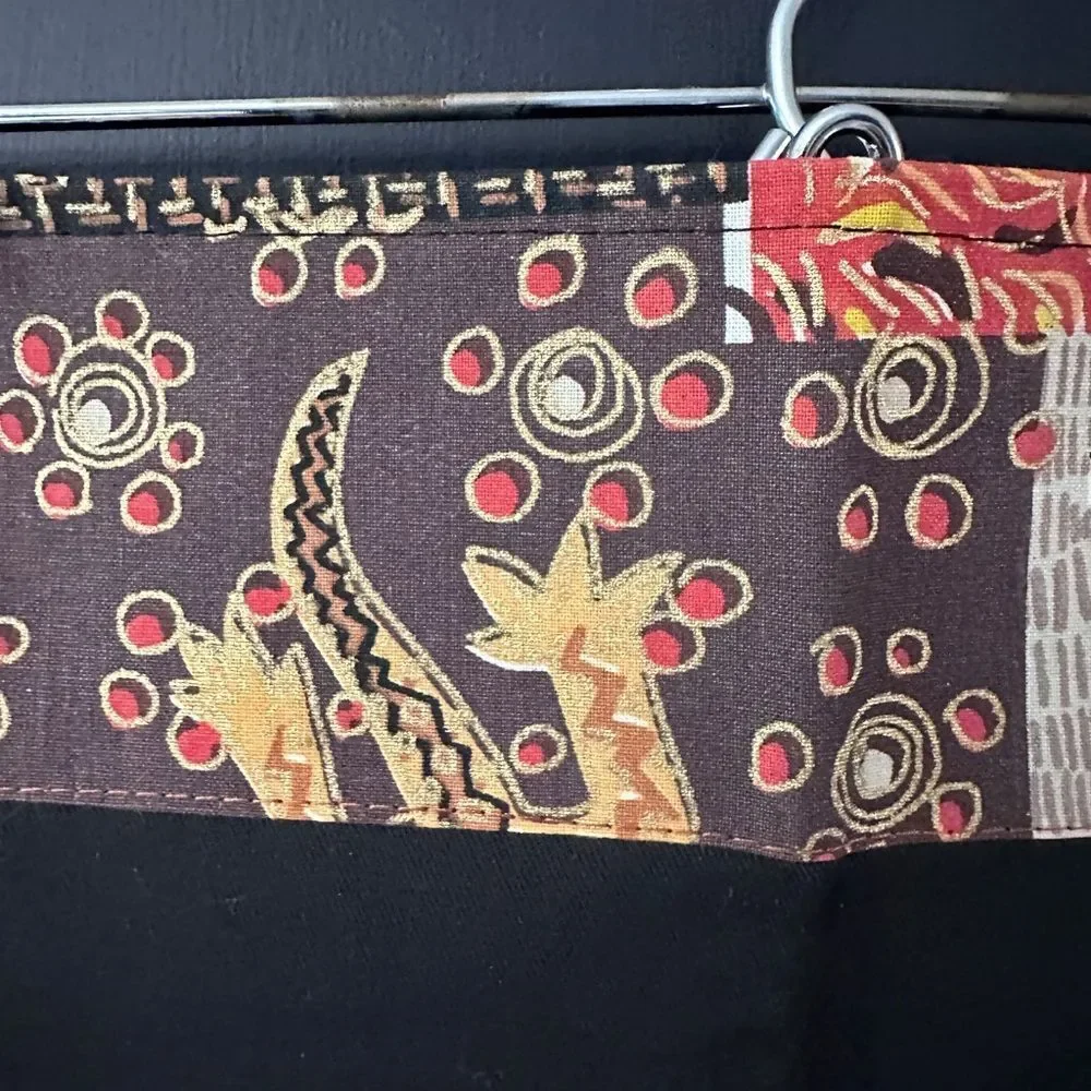 NWT Pair of Cloth Napkins from Africa. Plain black with printed lined edge 16.5”
